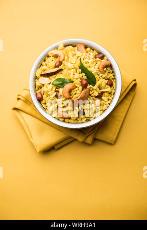 Jada Poha Namkeen Chivda / Thick Pohe Chiwda is a jar snack with a mix of sweet, salty and nuts flavours, served with tea. selective focus Stock Photo