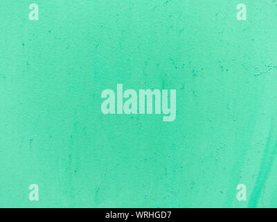 Green pastel painted cement wall. Abstract grunge texture background. Copy space, empty template for text Stock Photo