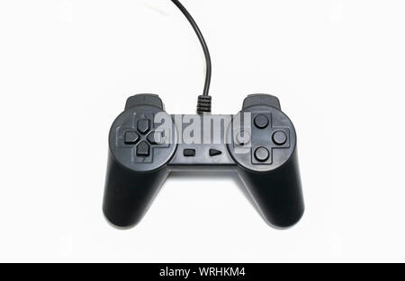 Black game controller isolated on white background. Stock Photo