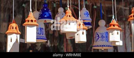 BRATISLAVA, SLOVAKIA - SEPTEMBER 04, 2019: Souvenirs from Slovakia. Clay bells made in the form of houses Stock Photo