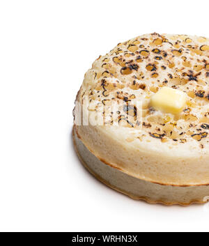 Stack  of wholemeal crumpets isolated on white background Stock Photo