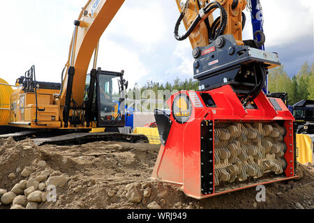 Hyvinkaa, Finland. September 6, 2019. ALLU D Transformer hydraulic attachment for material handling applications on Cat 330F excavator on Maxpo 2019. Stock Photo