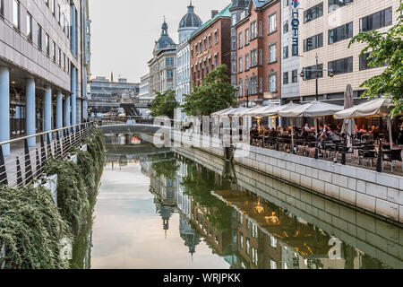 Downtown Aarhus with the canal and restaurants in the evening, reflecting in the water, Denmark, July 15, 2019