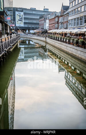 Downtown Aarhus with restaurants reflecting in the canal and space for copy, Denmark, July 15, 2019