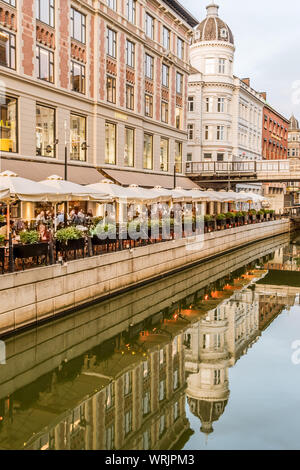 Aarhus city with a variety of restaurants reflecting in the canal, Denmark, July 15, 2019