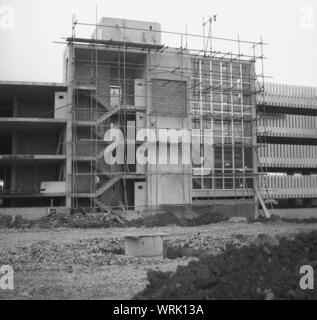 1967, historical, exterior view of a new multi-storey car park being built, England, UK. Using concrete, hundreds of new car parks in the 'Brutalism' style of architecture were built in this era across the UK, as car ownership rose significantly. Stock Photo