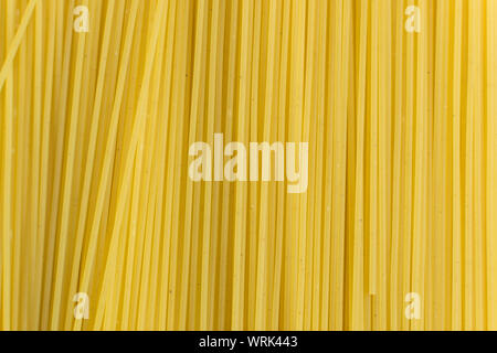 Background texture and pattern of boiled egg noodles or spaghetti pasta in full-frame format. View from above. Close-up Stock Photo