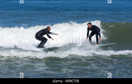 Surfing on Newcomb Hollow Beach, Wellfleet, Massachusetts on Cape Cod, USA Stock Photo