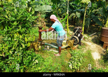 Indian farmer water pump Stock Photo