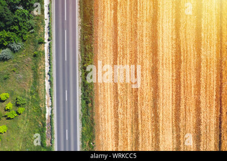 Farm land aerial view from above near country road, drone view ladnscape. Crops concept Stock Photo