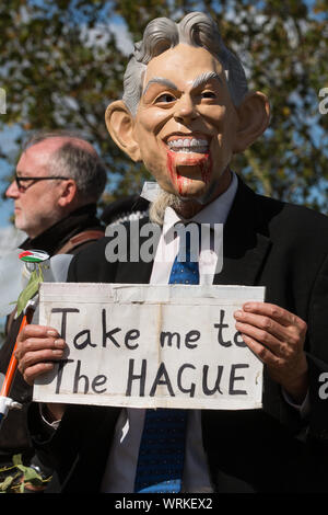 London, UK. 5 September, 2019. A man wearing a Tony Blair mask stands among activists taking part in a Conference At The Gates (CATG) outside ExCel Lo Stock Photo