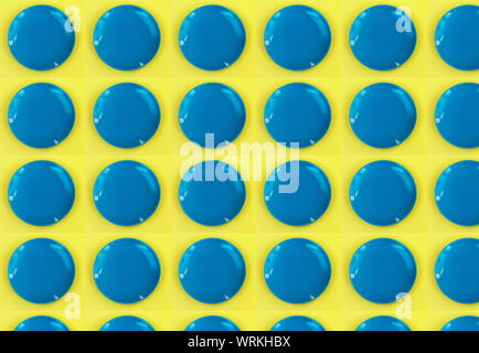 Digital seamless pattern with blue circles on yellow background. Repeating elements Stock Photo