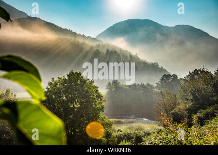 Mountains and morning fog over the forest Stock Photo