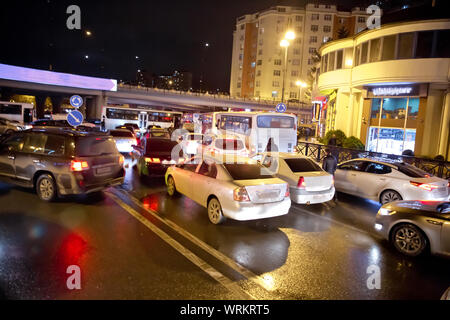 Evening traffic jam in Baku on one of streets in the downtown . Queue of cars on the street during the rush hour . Traffic jam in the rush hour . Stock Photo