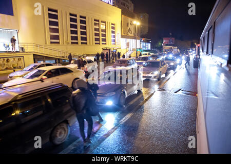 Evening traffic jam in Baku on one of streets in the downtown . Queue of cars on the street during the rush hour . Traffic jam in the rush hour . Stock Photo