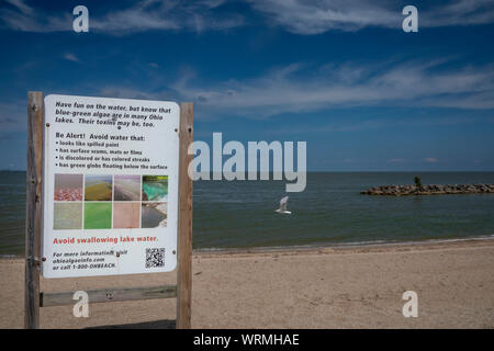Oregon, Ohio - A sign warns of blue-green algae in the water of Lake Erie at Maumee Bay State Park. Caused largely by phosphorus runoff from agricultu Stock Photo