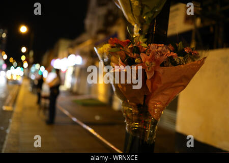 Flowers left at the scene in Edgware Road, near the junction with Church Street in Westminster where a 17-year-old boy was stabbed to death. PA/ Photo. Picture date: Tuesday September 10, 2019. See PA story POLICE Westminster. Photo credit should read: Aaron Chown/PA Wire Stock Photo