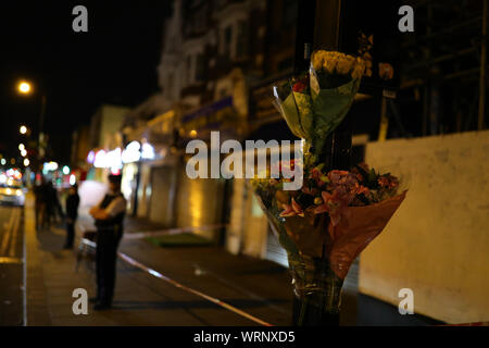Flowers left at the scene in Edgware Road, near the junction with Church Street in Westminster where a 17-year-old boy was stabbed to death. PA/ Photo. Picture date: Tuesday September 10, 2019. See PA story POLICE Westminster. Photo credit should read: Aaron Chown/PA Wire Stock Photo