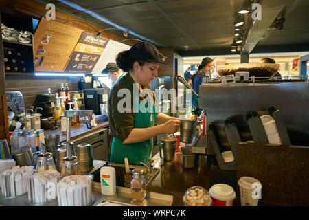 MOSCOW, RUSSIA - CIRCA OCTOBER, 2018: barista prepare coffee at Starbucks. Stock Photo