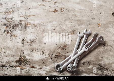 Spanners. Many wrenches. Industrial background. Set of wrench tool equipment. Set of wrenches in different sizes on grey background. Top view with Stock Photo