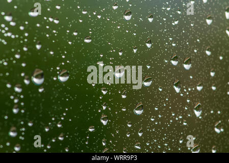 Rain drops collected on glass window pane during thunderstorm, Castle Rock Colorado US. Photo taken in early September. Stock Photo