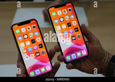 Cupertino, USA. 10th Sep, 2019. A man holds Apple's new smartphone models, the iPhone 11 Pro (l) and the iPhone 11 Pro Max at the Steve Jobs Theater on the corporate campus. Apple presented a total of three new iPhone models, a new Apple Watch and a new iPad at the event. Apple is heavily relying on better cameras for its new iPhone generation to boost recent declines in sales of its flagship product. Credit: Christoph Dernbach/dpa/Alamy Live News Stock Photo
