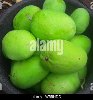 High Angle View Of Green Mangoes In Container