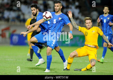 Kuwait City, Kuwait. 10th Sep, 2019. Fahad Alhajeri (L) of Kuwait vies with Adam Taggart of Australia during the FIFA World Cup Qatar 2022 and AFC Asian Cup 2023 Preliminary Joint Qualification Second round group B football match between Kuwait and Australia in Kuwait City, Kuwait, on Sept. 10, 2019. Credit: Ghazy Qaffaf/Xinhua Stock Photo