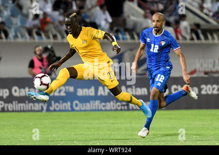 Kuwait City, Kuwait. 10th Sep, 2019. Awer Mabil (L) of Australia competes during the FIFA World Cup Qatar 2022 and AFC Asian Cup 2023 Preliminary Joint Qualification Second round group B football match between Kuwait and Australia in Kuwait City, Kuwait, on Sept. 10, 2019. Credit: Ghazy Qaffaf/Xinhua Stock Photo