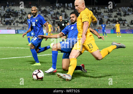 Kuwait City, Kuwait. 10th Sep, 2019. Faisal Alazemi (C) of Kuwait vies with Aaron Mooy (R) of Australia during the FIFA World Cup Qatar 2022 and AFC Asian Cup 2023 Preliminary Joint Qualification Second round group B football match between Kuwait and Australia in Kuwait City, Kuwait, on Sept. 10, 2019. Credit: Ghazy Qaffaf/Xinhua Stock Photo