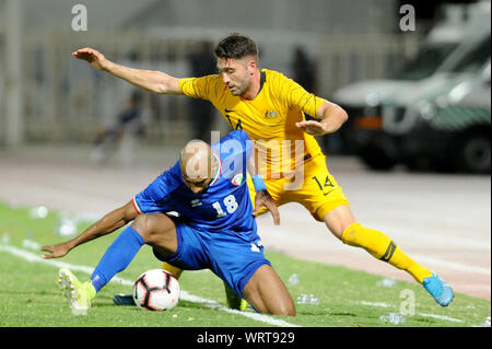 Kuwait City, Kuwait. 10th Sep, 2019. Amer Almatoug Alfadhel (front) of Kuwait vies with Brandon Borrello of Australia during the FIFA World Cup Qatar 2022 and AFC Asian Cup 2023 Preliminary Joint Qualification Second round group B football match between Kuwait and Australia in Kuwait City, Kuwait, on Sept. 10, 2019. Credit: Ghazy Qaffaf/Xinhua Stock Photo