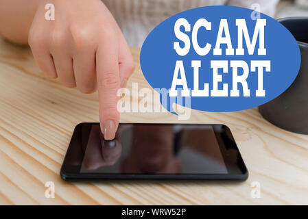 Text sign showing Scam Alert. Business photo text unsolicited email that claims the prospect of a bargain woman using smartphone office supplies techn Stock Photo