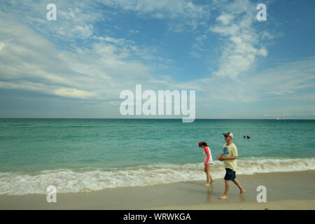 American looking senior walking on the beach - Senior Lifestyle Stock Photo