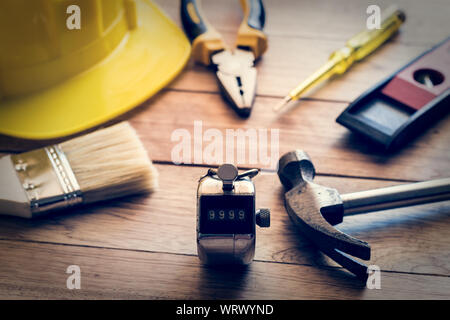 Construction tools on wooden plank in vintage style background Stock Photo