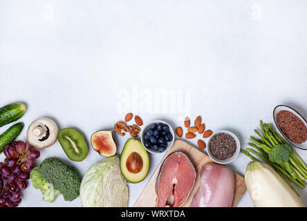 trendy pegan diet. pegan diet products : meat, fish, cereals, vegetables, nuts and berries. view from above Stock Photo