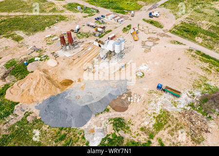 aerial image of city construction site. cement processing facility and various building machines and equipment Stock Photo