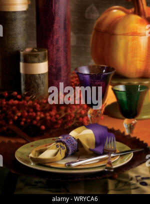Close-up Of Plates And Glasses On Dining Table