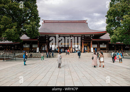 DEC 5, 2018 Tokyo, Japan - Meiji Jingu Shrine Historic Wooden main hall and shrine square with many tourists - Most important shrine of Japan capital Stock Photo