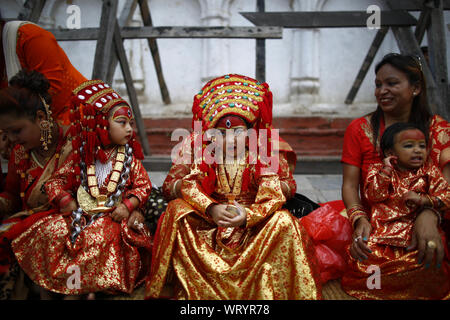 Kathmandu, Nepal. 11th Sep, 2019. Girls adorned as a Living Goddess take part in prayer rituals during Kumari Puja in Kathmandu, Nepal on Wednesday, September 11, 2019. Hundreds of young girls under the age of nine gathered around the temple to offer worship for good luck, protection from evil and prevent from diseases. Credit: Skanda Gautam/ZUMA Wire/Alamy Live News Stock Photo