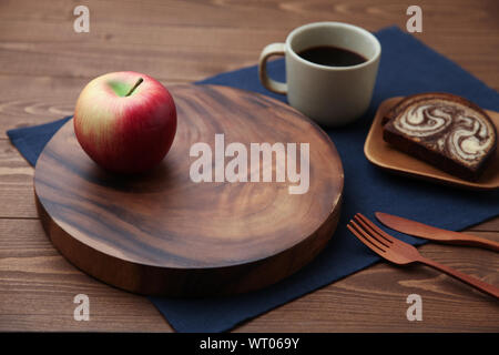 apple, black hot coffee and marble chocolate pound cake closeup isolated on wood table Stock Photo