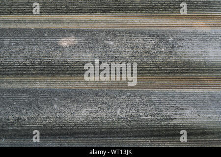 Gray wavy slate for the roof. Vertical view. Close-up. Background. Texture Stock Photo