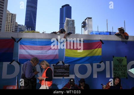 Brisbane, Queensland, Australia. 6th Aug, 2019. Construction workers watch on at 1 William Street during the Extinction Rebellion demonstration.Members of the public gather as the 'Extinction Rebellion', an international group that rallies, and causes civil disobedience in the hopes of forcing the government to enact further pollution and climate change policy. People in Brisbane and many other cities around the world gathered on the 6th of August to protest and halt public transport and business in order to meet their demands. Credit: Joshua Prieto/SOPA Images/ZUMA Wire/Ģ����ý Live News Stock Photo