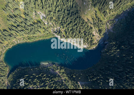 Aerial footage of Kaindy lake and sunken forest in Kazakhstan Stock Photo
