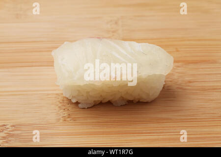 sushi of red snapper closeup isolated on cutting board Stock Photo