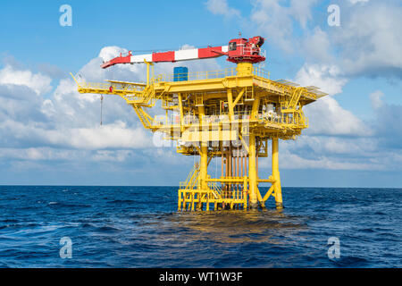 Offshore oil and gas wellhead remote platform produced raw gases and crude oil for sent to central processing platform then treat and sent to refinery Stock Photo