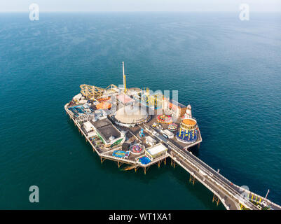 Aerial photo of the famous Brighton Pier and ocean located in the south coast of England UK that is part of the City of Brighton and Hove, Stock Photo