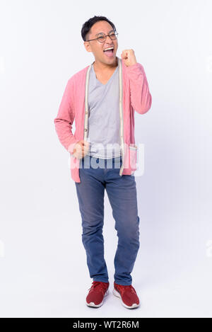Full body shot of happy Japanese businessman in suit smiling Stock ...