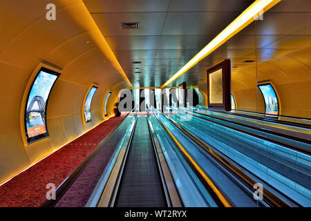 Underground passageway to Fullerton Hotel Singapore with moving travellators in perspective view Stock Photo