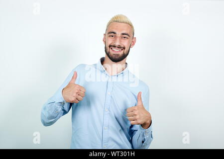 man with blond hair, black beard over isolated white background shows emotions Stock Photo