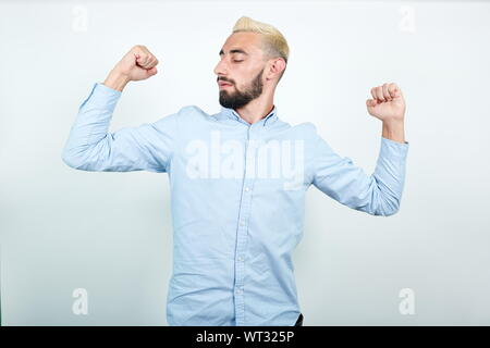 man with blond hair, black beard over isolated white background shows emotions Stock Photo